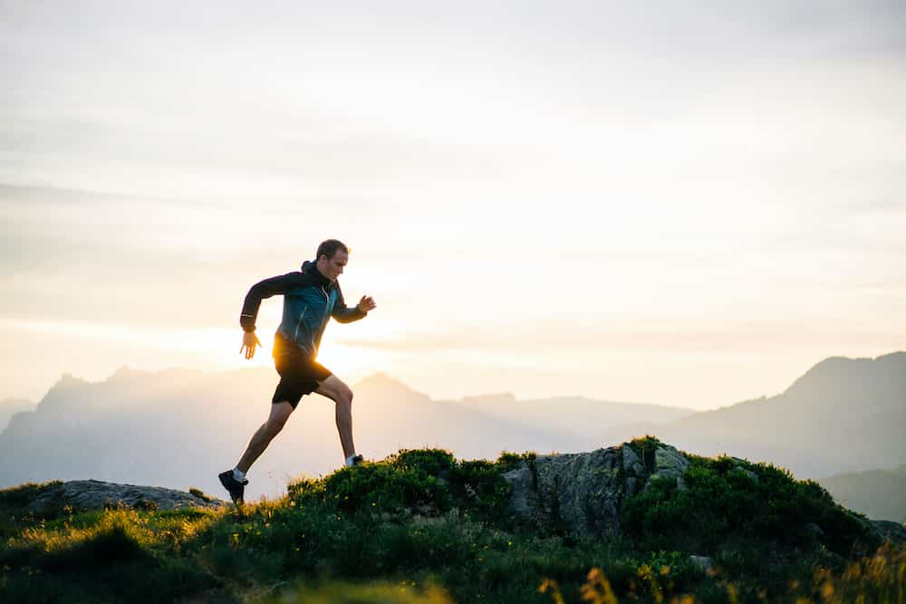 Young man runs on mountain ridge at sunrise - The Future Will Always Be Better Than The Past