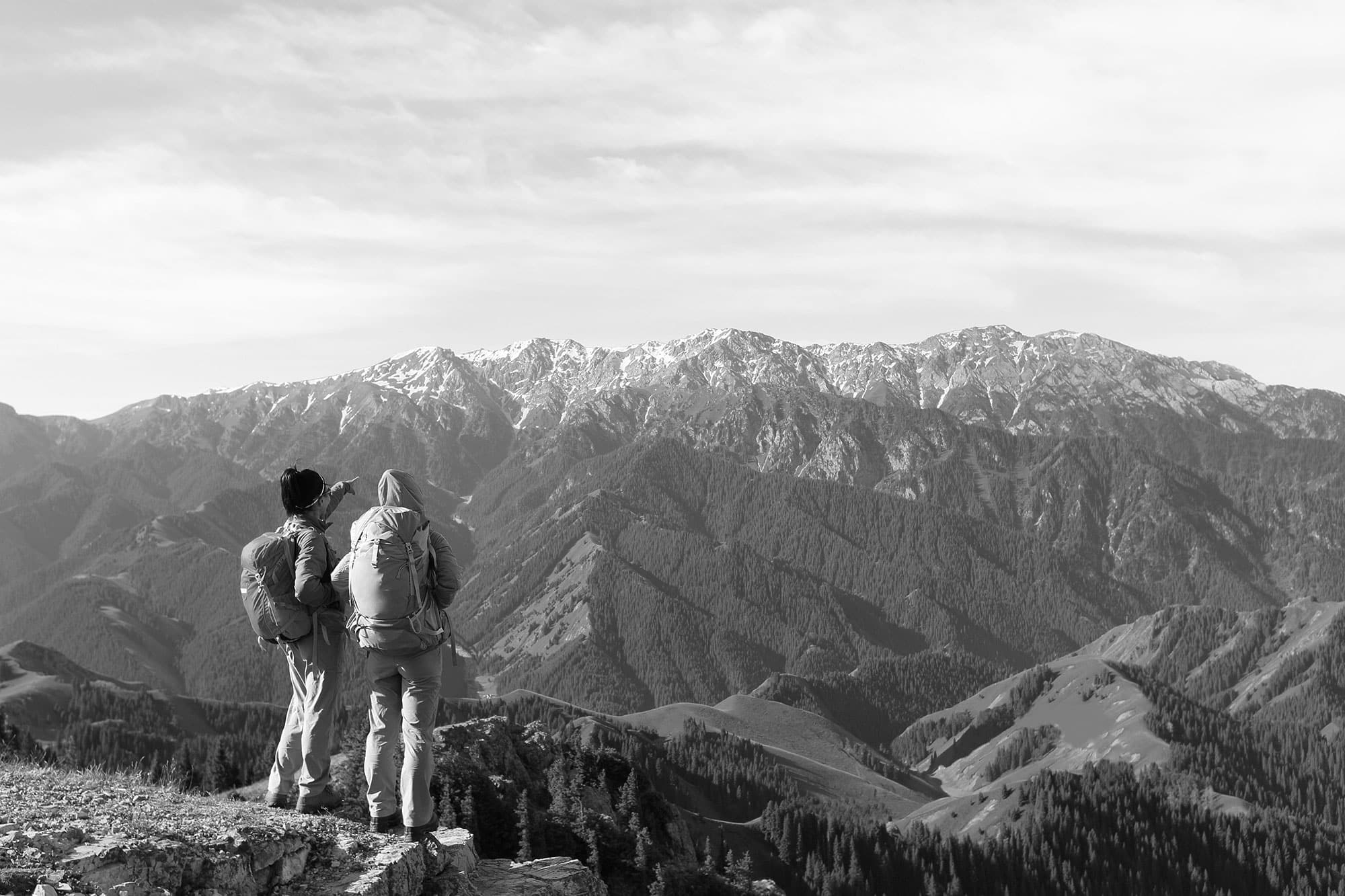 hiking-friends-enjoy-the-view-on-mountain-peak-P26MPDJ-copy hiking friends enjoy the view on mountain peak